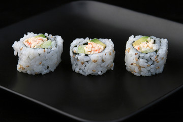 sushi on black plate 1