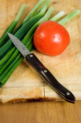 tomato, scallions and knife