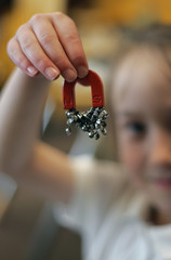 girl holding magnet