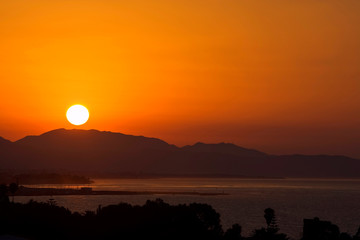 golden sunrise over port of marbella