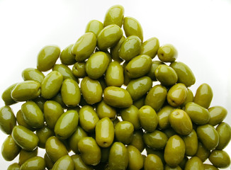 delicious group of shinny olives over a white back