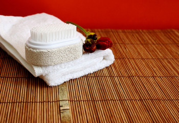 pumice brush and towel at a spa - copy space