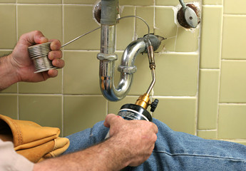 plumber welding pipe