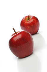 a pair of red apples