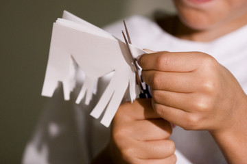 boy cut out paper
