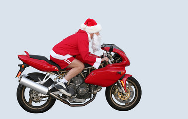 Fototapeta na wymiar santa claus on a motorcycle in ca