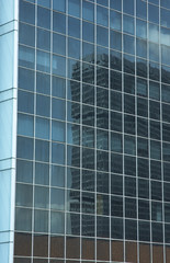 reflection in the windows of office building