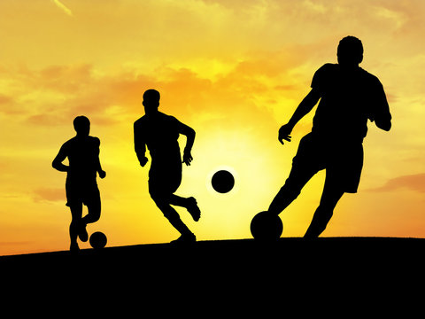 soccer players training (sunset)