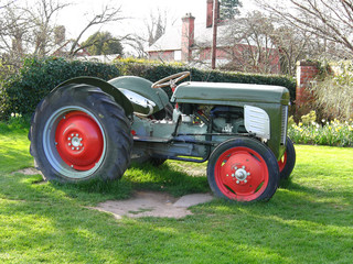 old tractor in green field