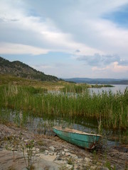 mountain lake landscape and boat