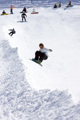 Fototapeta na wymiar snowboarder on half pipe of ski resort in spain