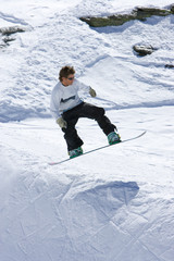 snowboarder on half pipe of ski resort in spain