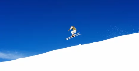Poster man skiing on slopes of ski resort in spain © Nick Stubbs