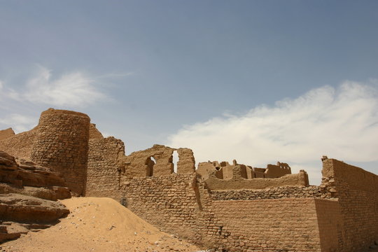 View of abandoned fort against cloudy sky