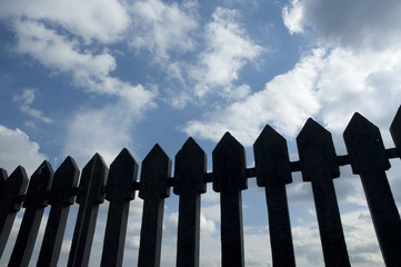 ancient fence against blue sky