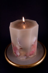 candle against black background