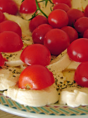 mozzarella cheese and tomatoes with olive