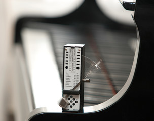 a metronome on a piano