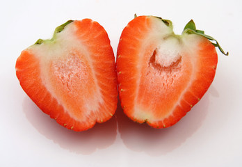 two halves of a strawberry