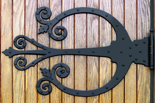ornate wrought iron doorhinge