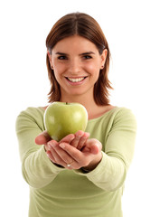 stock photo of a young woman holding green apple