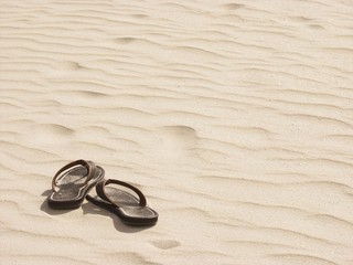 sandals, alone on the beach