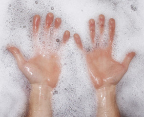hands in bubbles