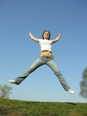 jump girl on meadow