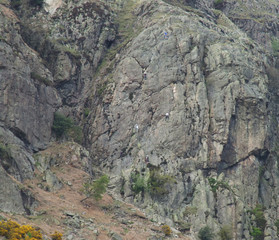 six climbers on a rockface