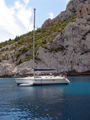 saliing yacht near riviera coastline