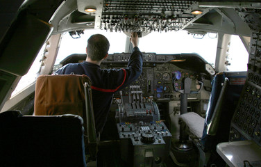Fototapeta premium pilot at controls