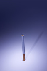 isolated cigarette under blue light