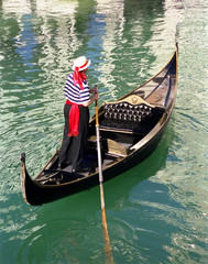 gondola and gondolier on the water