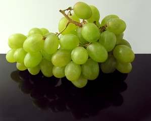 white grapes on a black table