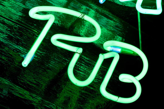 green neon sign pub