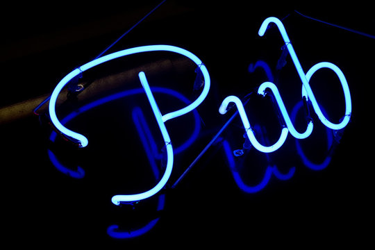 neon sign saying pub