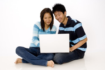 couple using laptop