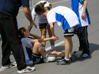 compassion - team players giving first aid - obrazy, fototapety, plakaty
