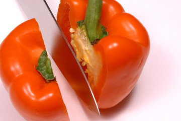 slicing a pepper in two