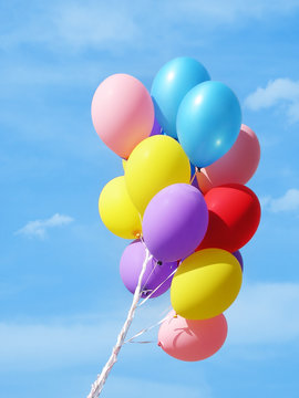 colorful balloons against sky