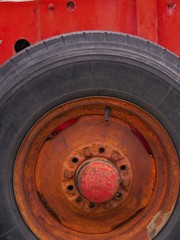 old tire and wheel painted a bright red
