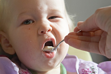 child eating pap
