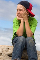 child in cap looking sideways