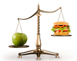 apple and hamburger on scales conceptual