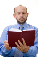 senior businessman reading a book