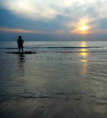 boy playing at the beach