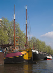 yachts in city canal, amsterdam, netherlands