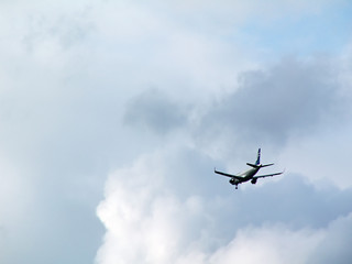 airplane on cloudy sky