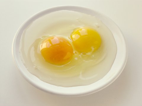 two raw hen's eggs