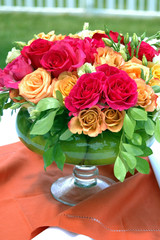 vase with red and orange roses